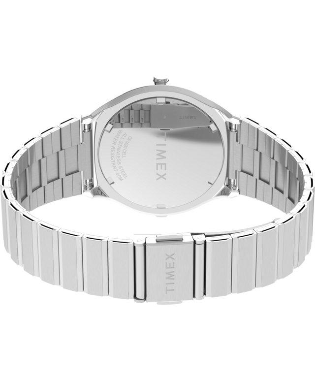 TW2Y06100 Q Timex® 1975 SSQ Edición digital reeditada, reloj de 38 mm con brazalete de acero inoxidable; imagen del fondo de la caja con accesorio