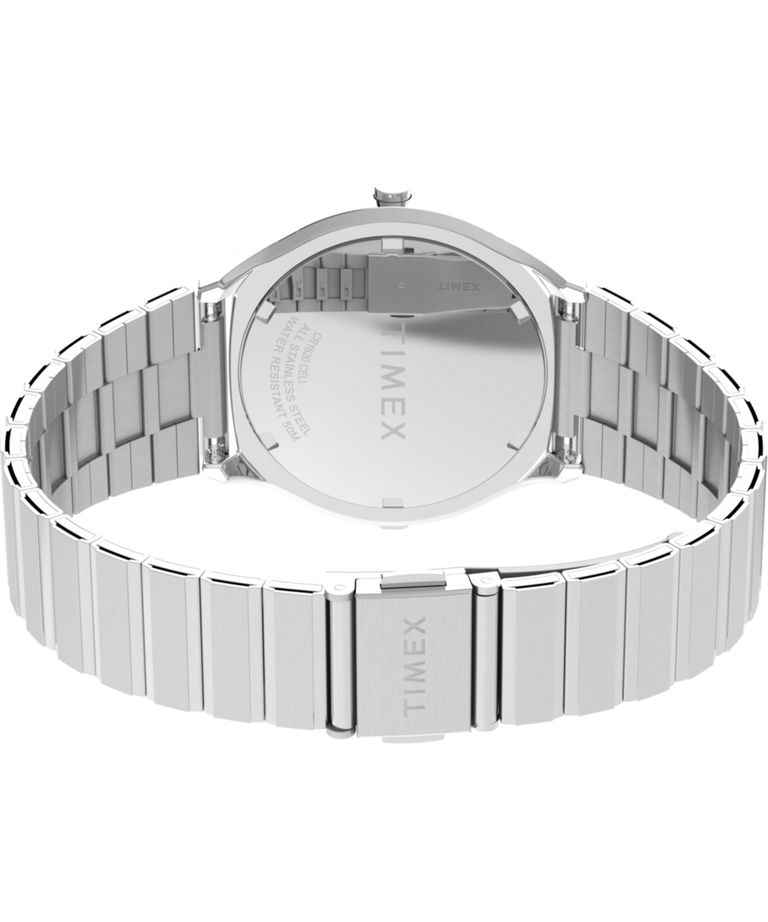 TW2Y06100 Q Timex® 1975 SSQ Edición digital reeditada, reloj de 38 mm con brazalete de acero inoxidable; imagen del fondo de la caja con accesorio