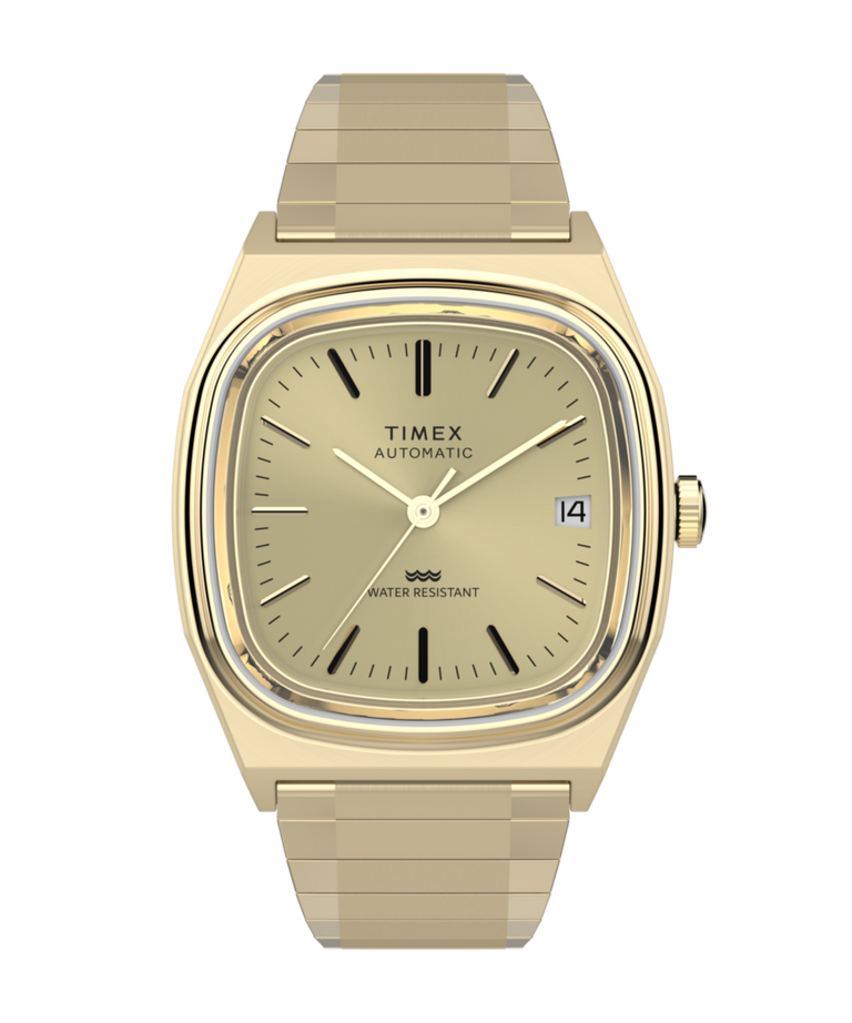 Imagen principal del reloj Timex® Automatic 1983 E Line Reissue de 34 mm con correa elástica en tono dorado TW2Y07200