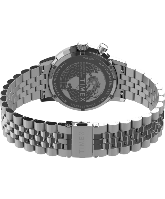 TW2Y09900 Marlin® Multifunción con fases lunares, 40 mm, brazalete de acero inoxidable. Imagen del fondo de la caja con accesorio