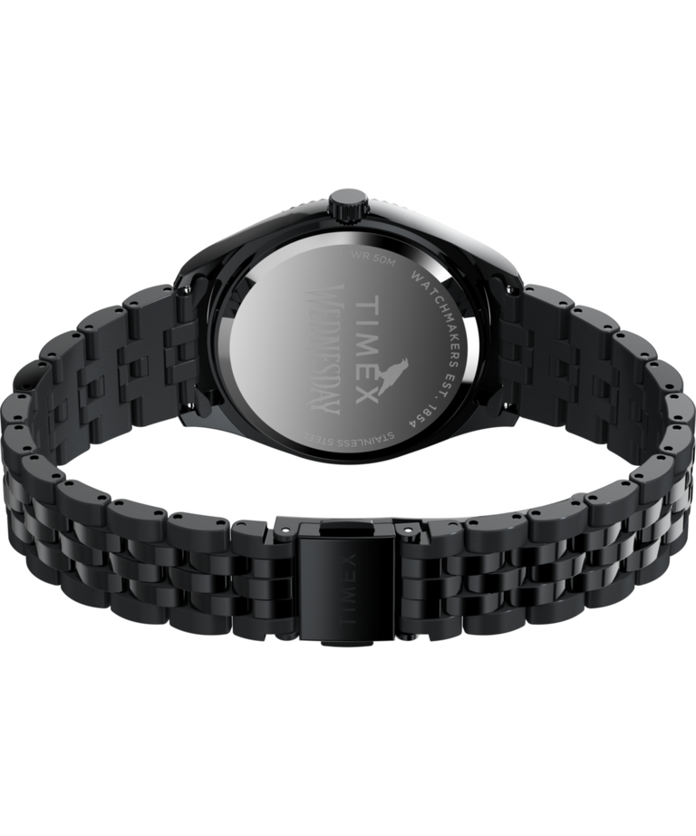 TW2Y19600 Timex x Wednesday Timex Legacy, reloj de 36 mm con brazalete de acero inoxidable. Imagen del fondo de la caja con accesorio.