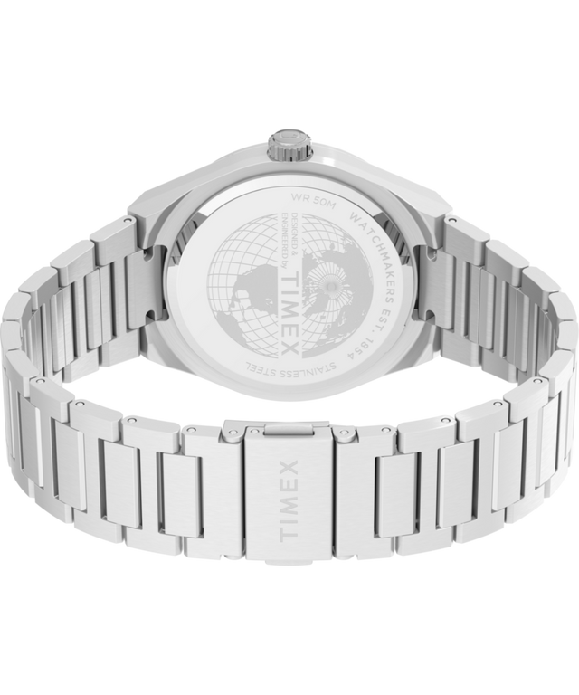 TW2Y25000 Q Reloj Timex® Continental con indicador de día y fecha, 39 mm, correa de acero inoxidable. Imagen del fondo de la caja con accesorio.
