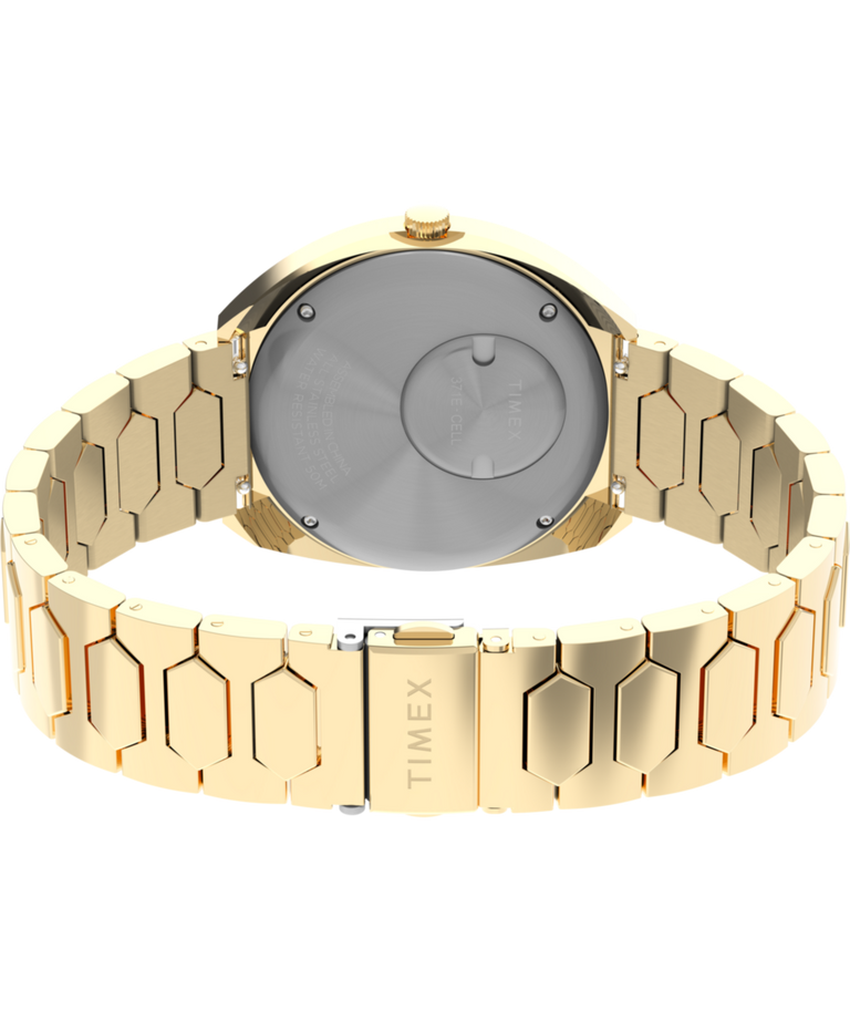 TW2Y45200 Q Timex® 1972 Time Machine Reissue, reloj de 39 mm con brazalete de acero inoxidable. Imagen del fondo de la caja con accesorio.