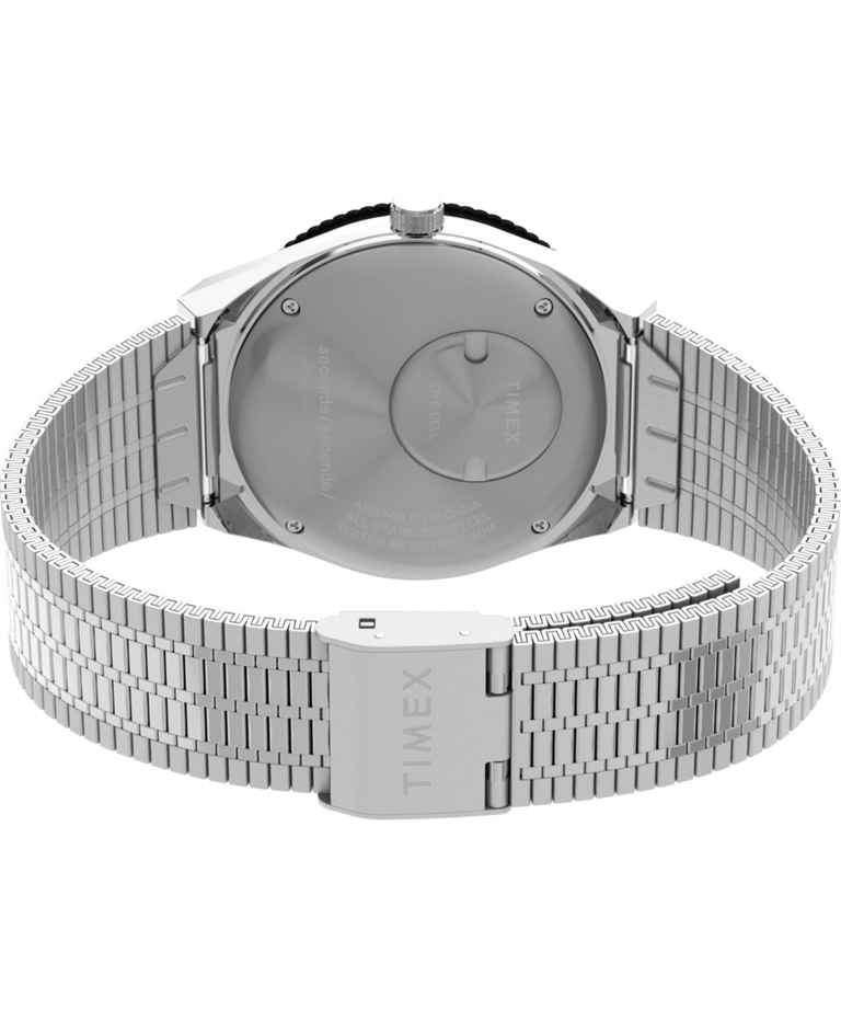 TW2Y48100 Timex x seconde/seconde/ Reloj de 38 mm con brazalete de acero inoxidable. Imagen del fondo de la caja con accesorio.