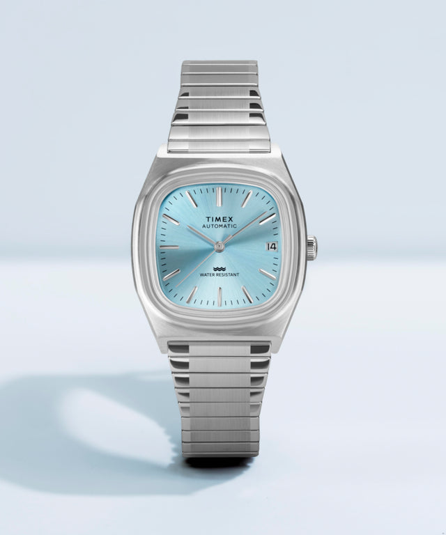 Imagen adicional de colaboración del reloj Timex® Automatic 1983 E Line de 34 mm con correa elástica de acero inoxidable TW2Y66700