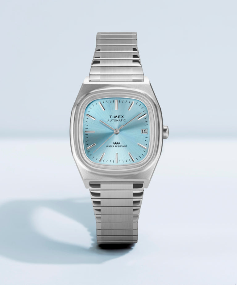 Imagen adicional de colaboración del reloj Timex® Automatic 1983 E Line de 34 mm con correa elástica de acero inoxidable TW2Y66700