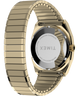 TW2Y67700 Reloj Timex® automático de 1983, línea E, 34 mm, con correa extensible de acero inoxidable. Imagen del fondo de la caja con accesorio.
