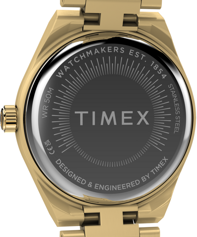 TW2Y68300 Q Timex® Continental Mini, reloj de 24 mm con brazalete de acero inoxidable. Imagen del fondo de la caja.