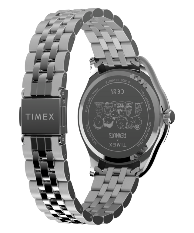 TW2Y85500 Reloj Peanuts® x Timex Legacy Snoopy con correa de acero inoxidable tipo paraguas   Imagen del fondo de la caja con el accesorio
