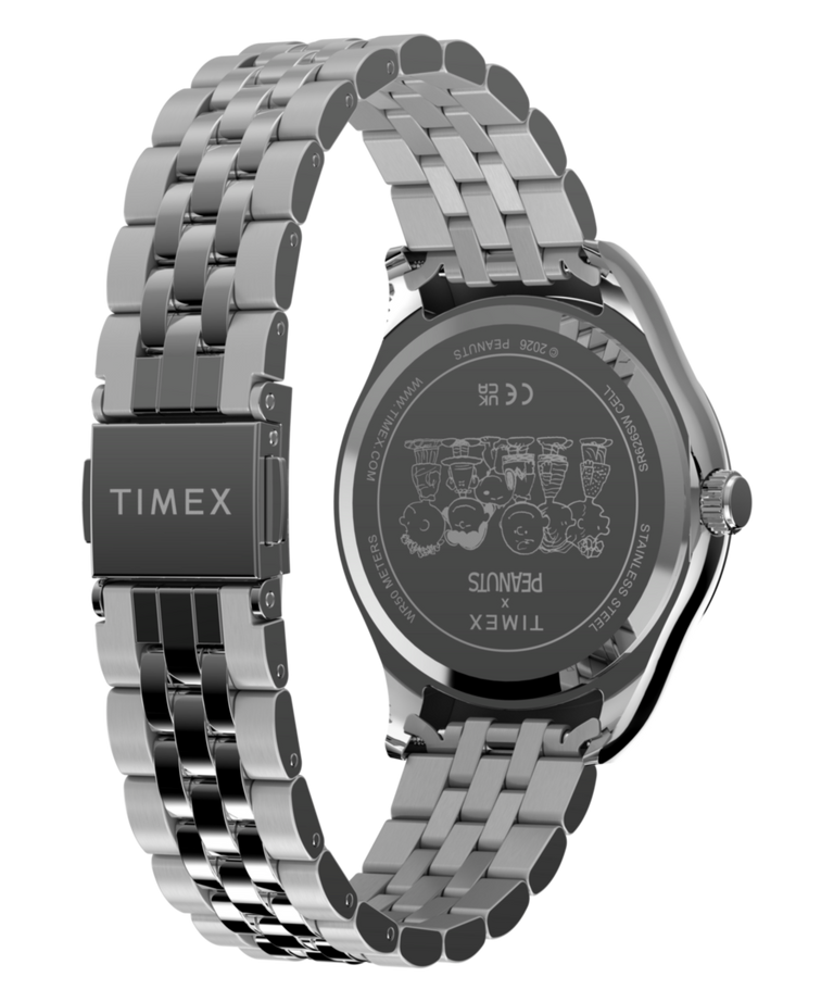 TW2Y85500 Reloj Peanuts® x Timex Legacy Snoopy con correa de acero inoxidable tipo paraguas   Imagen del fondo de la caja con el accesorio