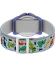 TW7C77300 TIMEX TIME MACHINES® Reloj infantil de 29 mm con correa elástica de tela y motivos de dinosaurios. Imagen del fondo de la caja con accesorio.