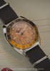 Fender x Timex Automatic shown through rotating close-ups of its wood-grain dial, silver-tone case, black strap, and guitar-inspired details.