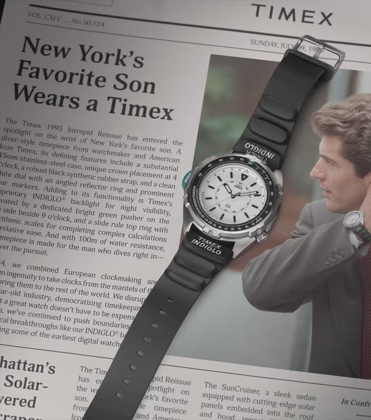 A cinematic close-up video of the Timex 1995 Intrepid Reissue wristwatch. The camera pans over the stainless steel case, textured dial, and luminous hands, highlighting vintage-inspired details. The watch is shown from multiple angles, emphasizing its retro design and durable construction.