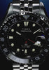 Scuba diver exploring a vibrant coral reef while wearing the Timex Deepwater Meridian 200 Automatic GMT, showcasing its underwater-ready design and 200-meter water resistance.