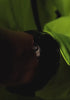 Timex Expedition® Capstone watch video showcasing its rugged black design and luminous functionality. The watch is featured on dark rocky terrain, emphasizing its brushed metal case, black silicone strap, and water resistance of 50 meters (165 feet).