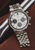 Timex Marlin Chronograph Tachymeter with silver dial and black subdials rotating on display, highlighting stainless-steel bracelet, polished case, and chronograph detailing.