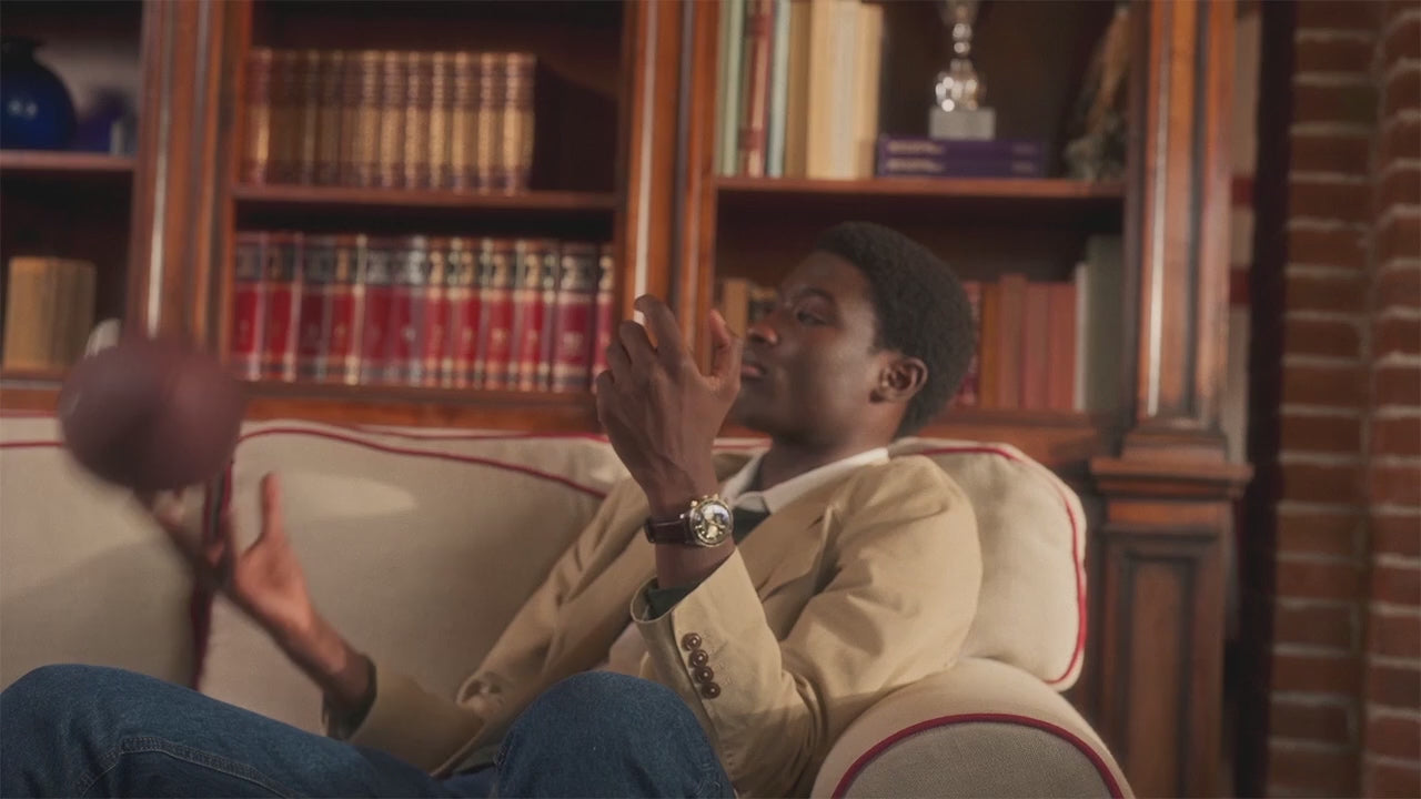 Video showcasing the Timex Waterbury Heritage Chronograph with a black dial, gold sub-dials, and brown perforated leather strap. The watch is featured in close-up shots and lifestyle angles, highlighting its gold-tone bezel, chronograph functionality, and refined craftsmanship, set against warm, vintage-inspired backdrops.