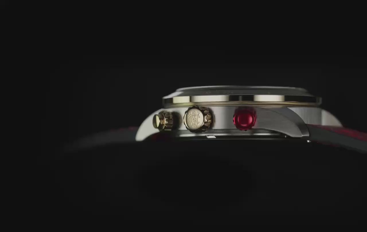 Timex Waterbury Heritage Chronograph with a black dial, gold-tone accents, and red leather strap rotates against a dark background, revealing its chronograph details and glowing green INDIGLO® display.