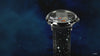 A promotional video of the Timex x Peanuts® Marlin® Hand-Wound Space watch. The black dial showcases Charlie Brown climbing a space module ladder while Snoopy floats beside him in a space helmet, set against a starry sky. The video highlights the polished stainless steel case, vintage-inspired hand-wound movement, and black leather strap decorated with white stars.
