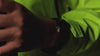 Timex Expedition® Capstone watch video showcasing its rugged black design and luminous functionality. The watch is featured on dark rocky terrain, emphasizing its brushed metal case, black silicone strap, and water resistance of 50 meters (165 feet).