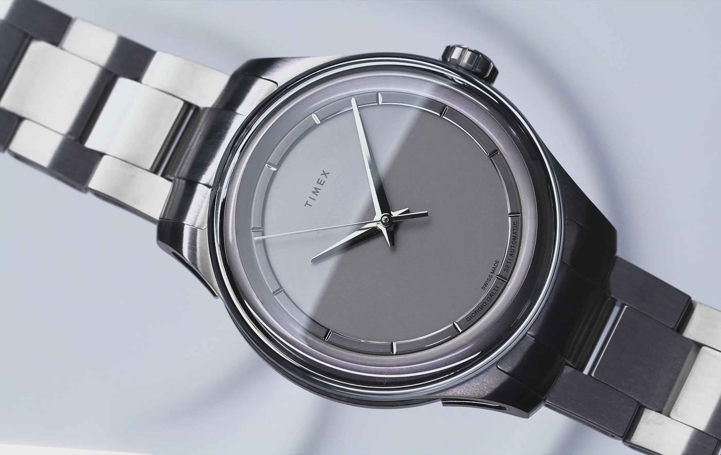 Video Close-up of the Giorgio Galli S2Ti watch, showcasing its minimalist silver dial, sleek titanium case, and brushed metal bracelet against a clean white background.