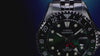 Scuba diver exploring a vibrant coral reef while wearing the Timex Deepwater Meridian 200 Automatic GMT, highlighting its dive-inspired design and 200-meter water resistance.